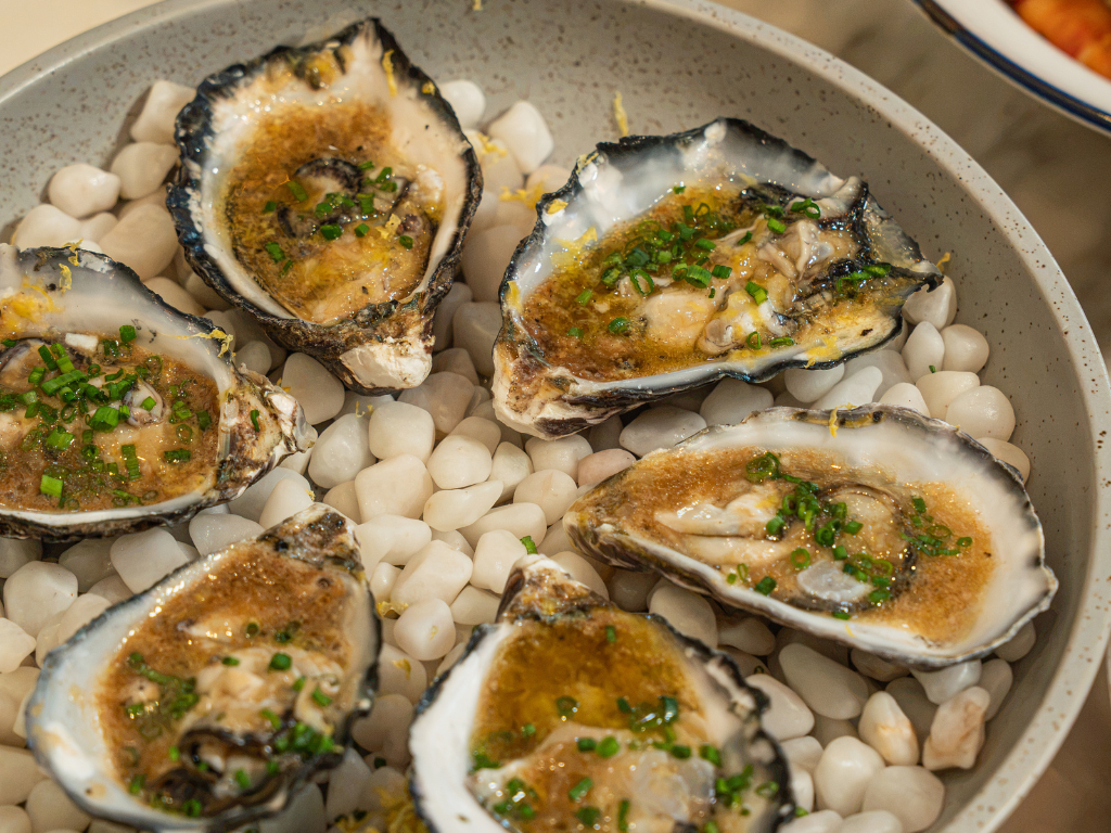 Coffin Bay oysters with lemon, sherry and shallots at Chicco Trattoria in Telok Ayer.
